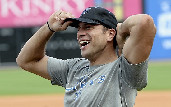 St. Paul Saints catcher/first baseman Vinny DiFazio shares a laugh with team mates during batting practice before the Saints game against Lincoln Saltdogs on Friday, July 24, 2015. (Pioneer Press: John Autey)